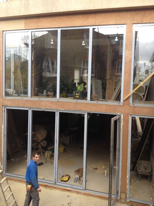 Aluminium bi-fold doors with two-storey glazing in Greenwich