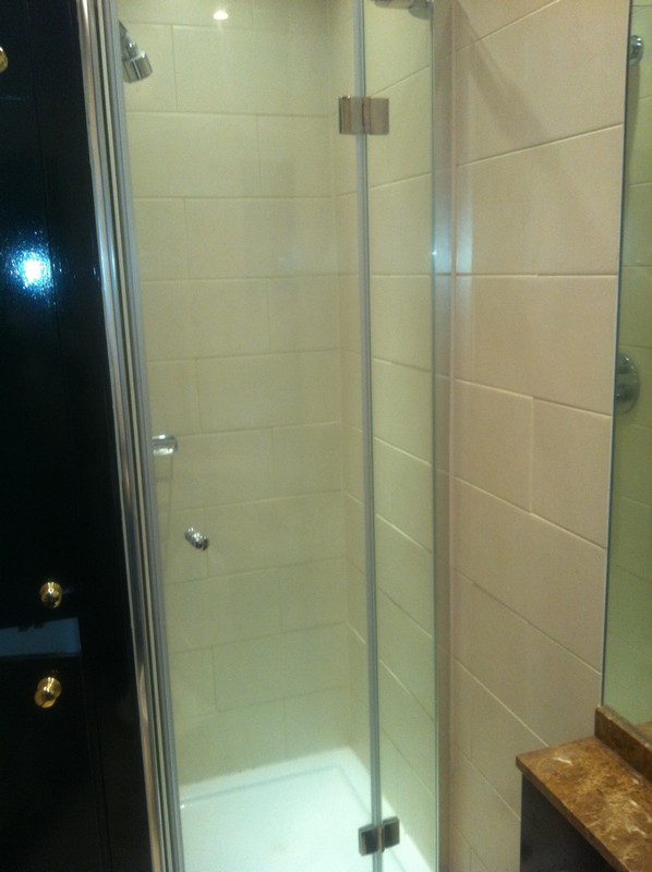 Frameless glass shower enclosure with chrome fittings in Greenwich