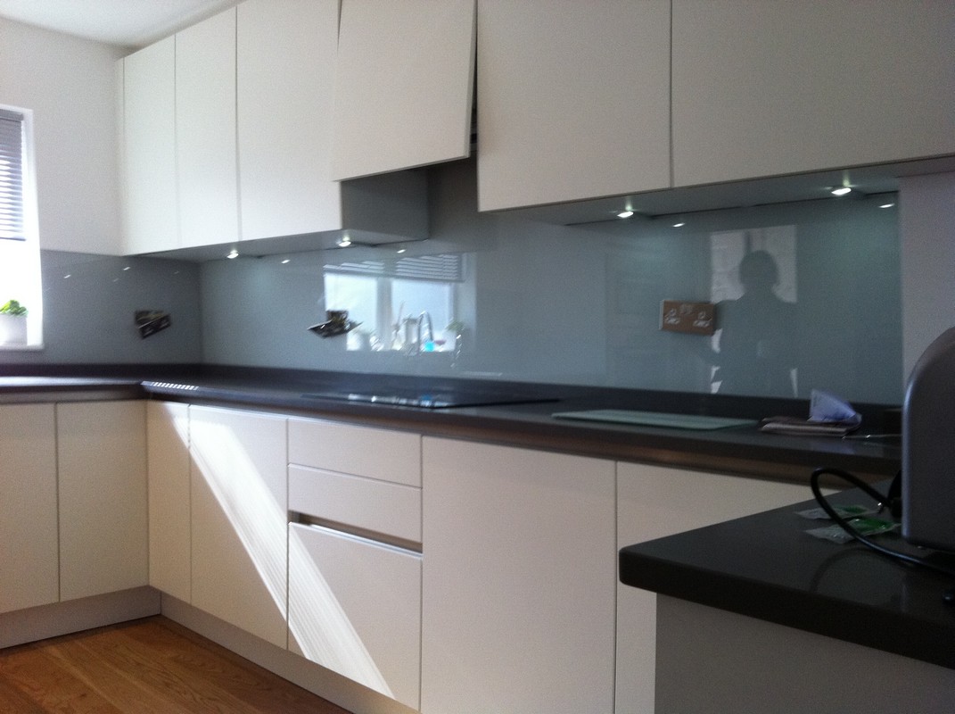 Grey glass kitchen splashback with LED lighting in Greenwich